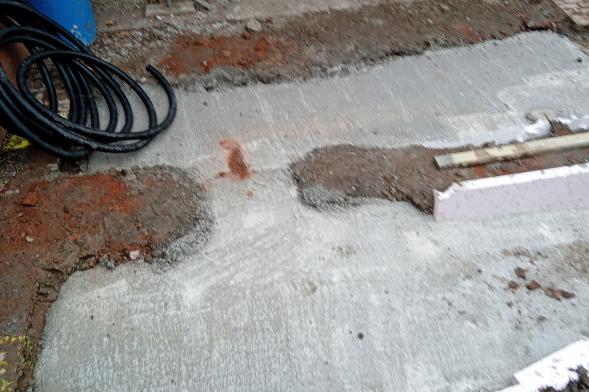 Concrete poured for new foundations as part of access ramp construction.