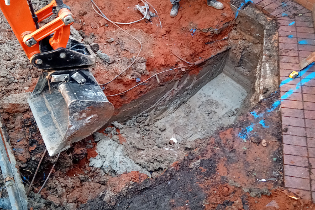 Excavation works for new pad foundations during access ramp construction.