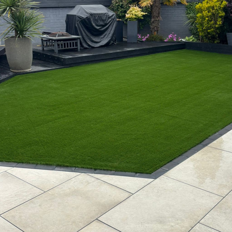 Artificial grass installation completed as part of a garden landscaping project.