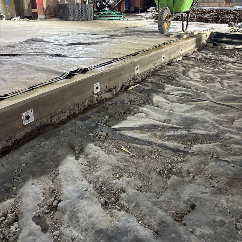 Concrete floor slab installation completed for commercial development.