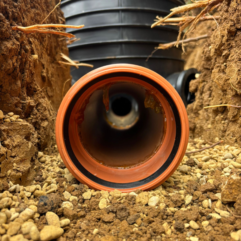 Newly installed drainage pipework within commercial groundworks project.