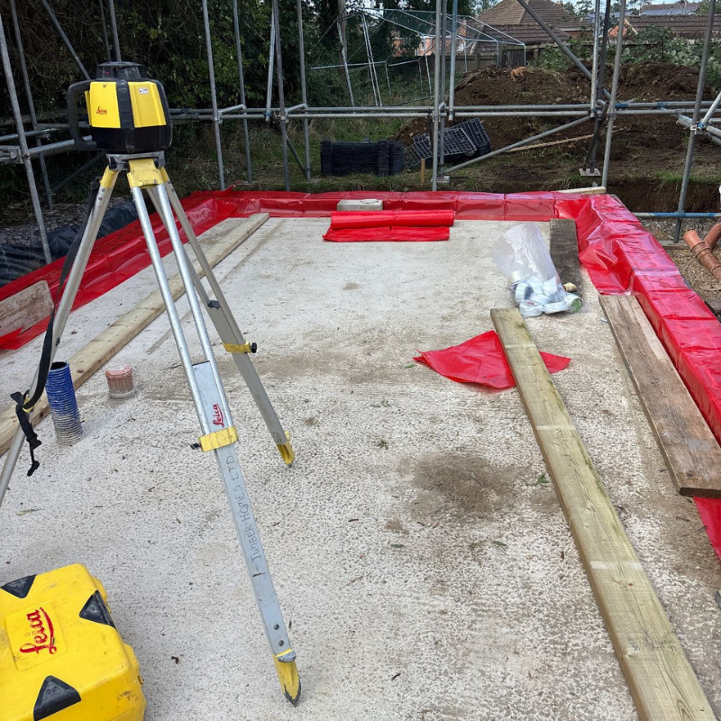 Concrete foundation slab prepared for commercial construction project.