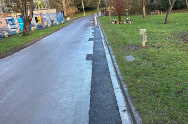 Commercial infrastructure works including road construction and kerb installation.