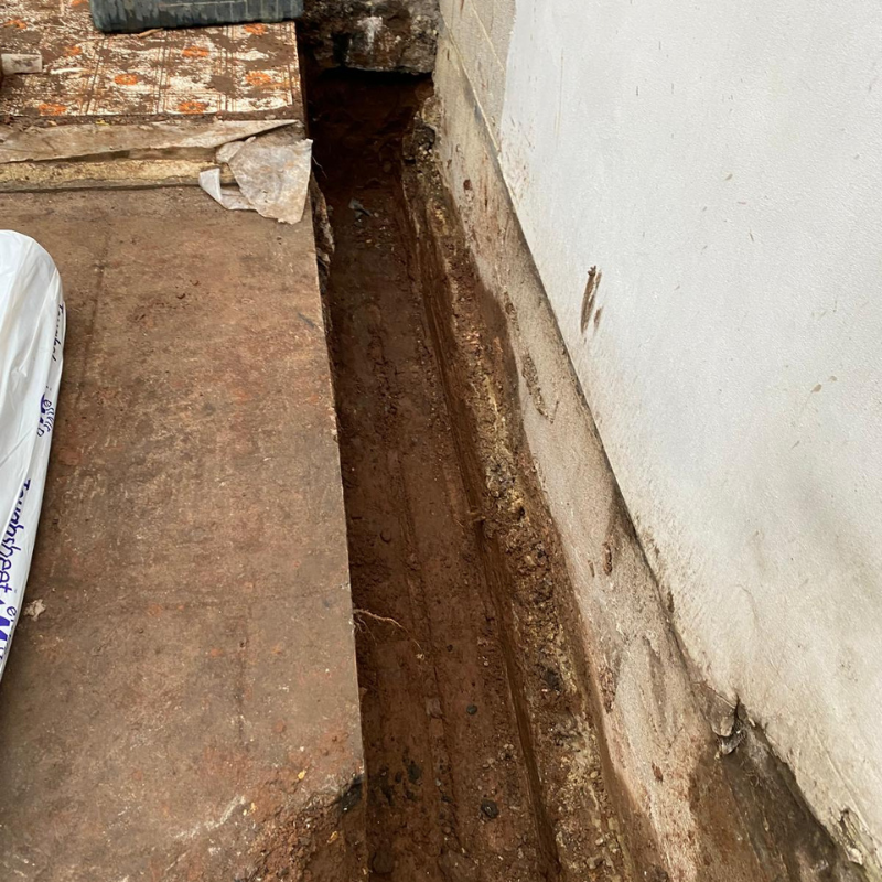 Excavated drainage trench prepared for underground drainage works in Bristol