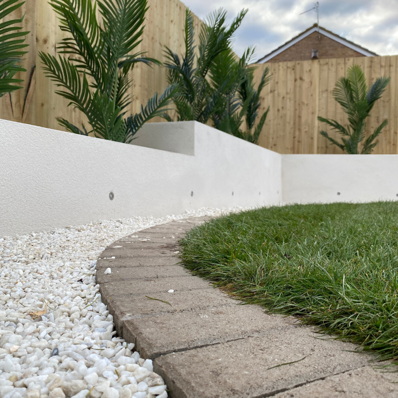 Curved landscaped garden border and lawn installation completed in Bristol.