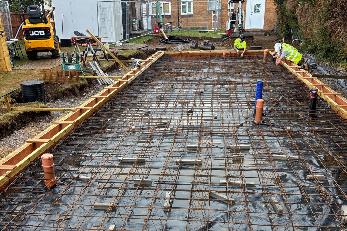 Rebar reinforcement and formwork prepared for a learning pod concrete foundation in Dursley.